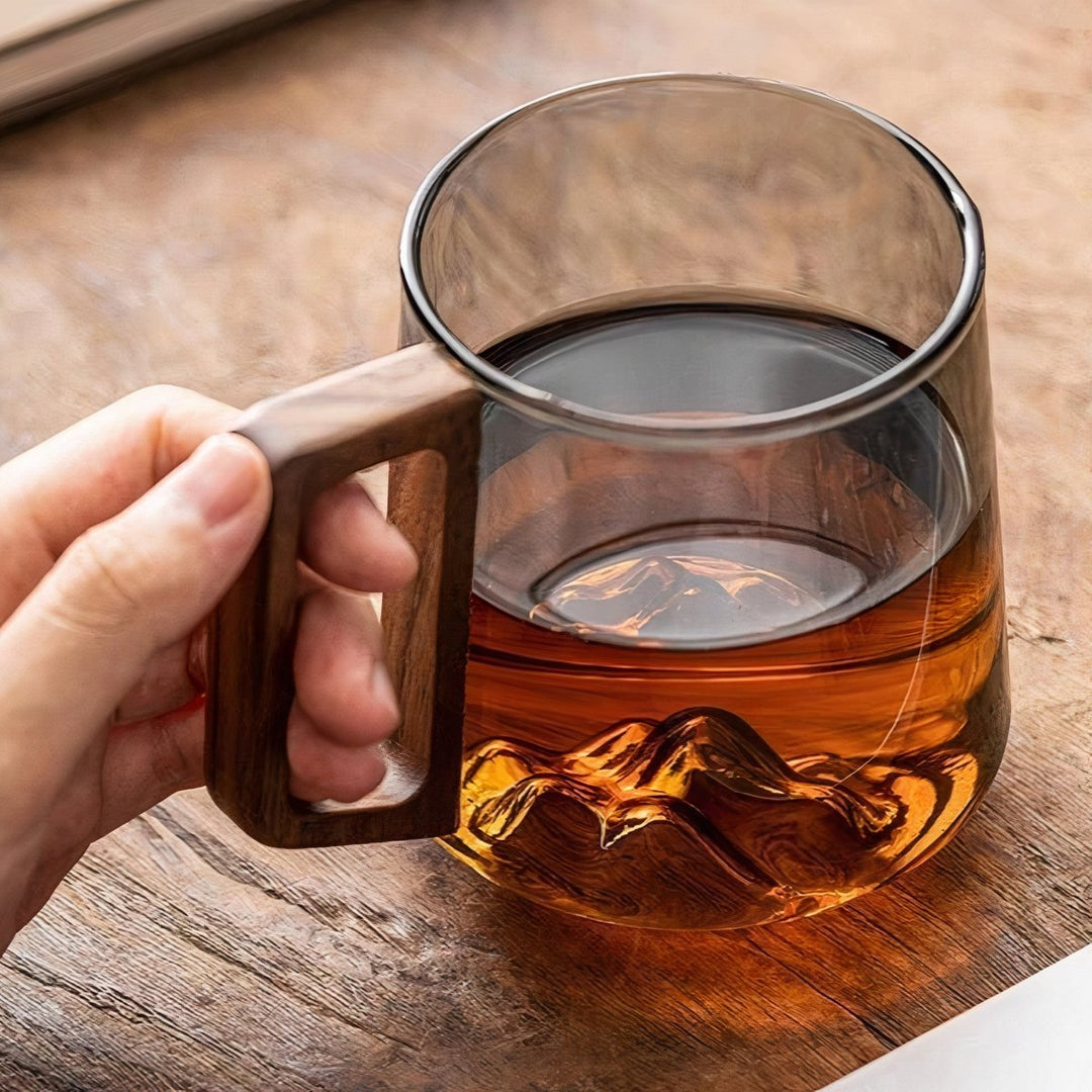 Elegant slanted coffee cups made of smoky glass with walnut wood handle