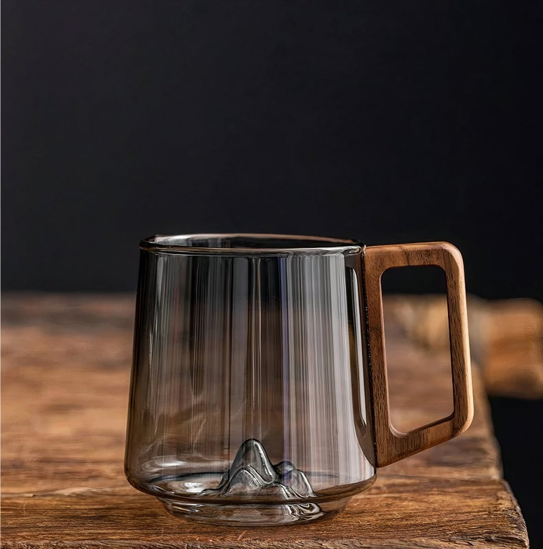 Elegant slanted coffee cups made of smoky glass with walnut wood handle