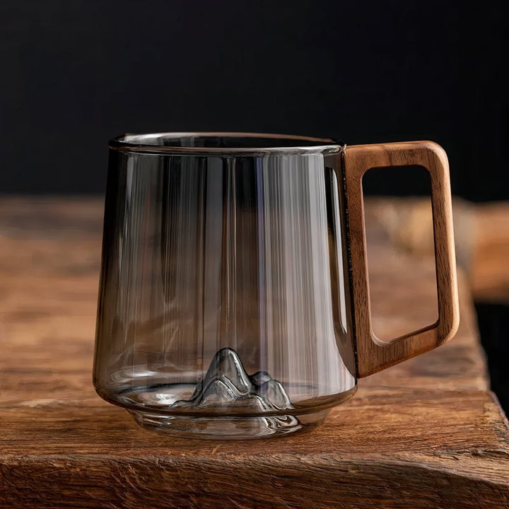 Elegant slanted coffee cups made of smoky glass with walnut wood handle